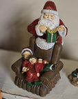 Babbo natale con poltrona e bimbi 17x13x18 cm