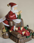 Babbo natale con poltrona e bimbi 17x13x18 cm