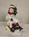Statuetta natalizia bambina con slitta 10x6x12 cm