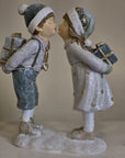 Statuetta decorativa bambini bacio con doni