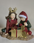 Statuetta decorativa bambini con pacco regalo
