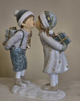 Statuetta decorativa bambini bacio con doni